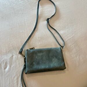 Vegan Leather Crossbody Bag with detachable strap and wristlet strap.